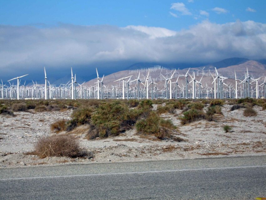 Rows Of Wind Turbines At Wind Farm At Hills